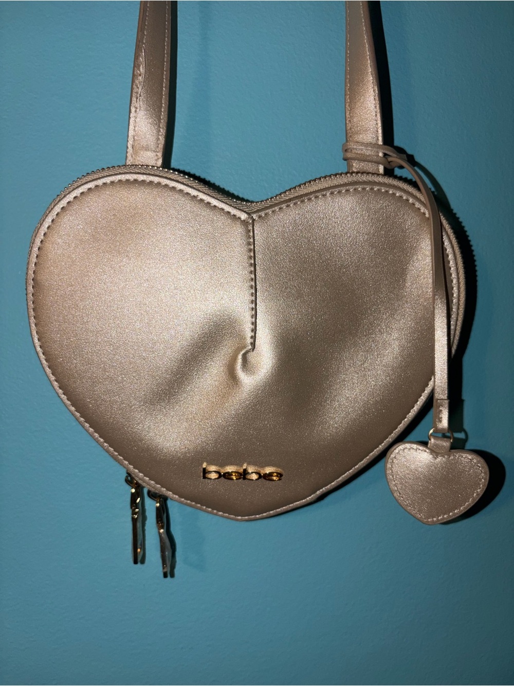 bebe Metallic Champagne Heart Crossbody Bag with Gold Logo